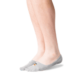 A pair of light gray low-cut no-show socks worn on a person's feet, shown against a plain white background. thumbnail
