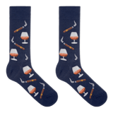 A pair of navy blue crew socks with a repeating pattern of cigars, smoking pipes, and cognac whiskey glasses, displayed against a solid white background. thumbnail