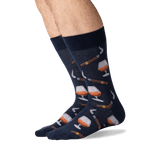 Navy socks with wine glass and bottle pattern worn by a person on a white background thumbnail