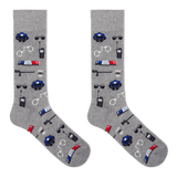 A pair of heather gray crew socks featuring a repeating pattern of police-themed items including blue police hats, walkie-talkies, handcuffs, batons, and red-and-blue light bars, shown on a plain white background. thumbnail