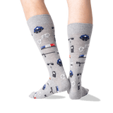 A pair of heather gray crew socks with a police-themed print, worn on a person's legs against a plain white background. thumbnail