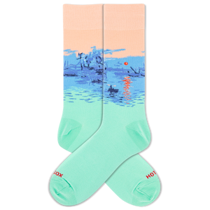 A pair of crew socks with a scenic landscape oh Monet's "Impression, Sunrise" design featuring a peach sky, blue water, and a small red sun, with the lower portion fading into mint green. The toes and heels are solid mint green, and the words 'HOTSOX' are printed in red on the toes.