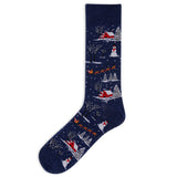 A single navy blue crew sock with a festive Christmas winter landscape pattern featuring snow-covered trees, red cabins, snowmen, and sleighs on a white background.