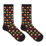 A pair of black crew socks with a repeating pattern of fast-food items including burgers, fries, drinks, and pizza slices, displayed against a solid white background.