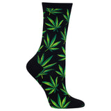 A single black crew sock with an all-over green and yellow cannabis leaf pattern, shown on a plain white background.