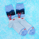 Socks with ski design on a blue textured background