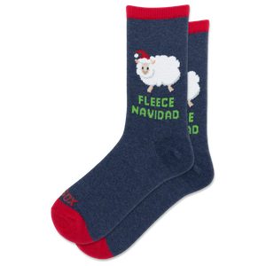 A pair of navy blue crew socks with red cuffs and toes, featuring a white sheep wearing a red Santa hat and the green text 'FLEECE NAVIDAD' on the front sock.