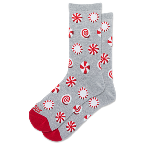 A pair of gray crew socks with a red and white candy cane pattern, featuring solid red toes and heels, displayed on a clean white background.
