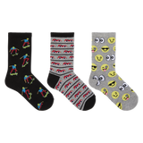 Three pairs of novelty crew socks displayed side-by-side on a plain white background. The left pair is black with colorful cartoon skateboarder prints. thumbnail