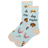 A pair of light blue crew socks with a 'dog mom' theme, featuring cartoon dog faces, and black script text saying 'dog mom,' shown on a plain white background.