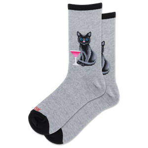 A pair of heather gray crew socks with black cuffs and heels, featuring a graphic of a black cat with blue eyes holding a pink cocktail on the front sock.