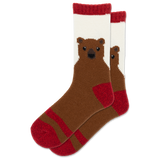 A pair of crew socks featuring a knitted brown bear face on a white background with red cuffs, heels, and toes, shown against a plain white background.