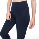 Black leggings worn by a person on a white background