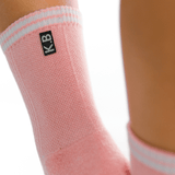 Pink ankle support brace with 'K.B' logo on a white background thumbnail