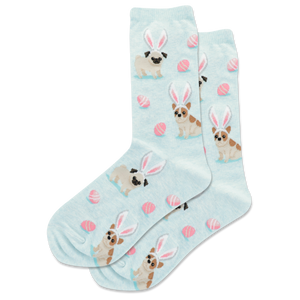 Light blue socks with dog illustrations wearing bunny ears and pink eggs on a white background