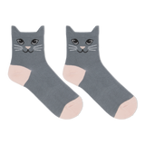 A pair of black ankle socks with a cat face design and blue accents on the heels and toes. thumbnail